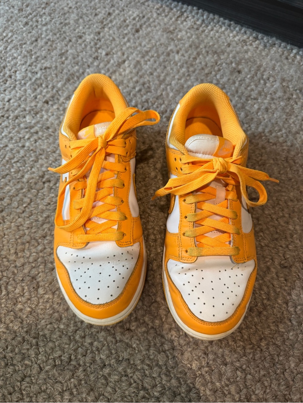 Nike women’s orange and white sneakers